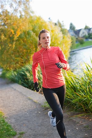 running and headphones - Woman Running in Green Lake Park, Seattle, Washington, USA Stock Photo - Rights-Managed, Code: 700-03554487