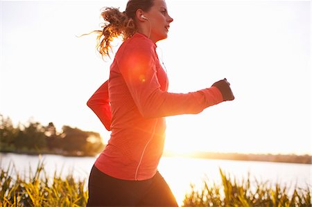 running with headphones - Woman Running in Green Lake Park, Seattle, Washington, USA Stock Photo - Rights-Managed, Code: 700-03554491