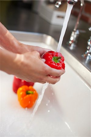 faucet - Woman Washing Peppers in Sink Stock Photo - Rights-Managed, Code: 700-03554509