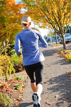 Woman Running on Sidewalk in Autumn, Seattle, Washington, USA Foto de stock - Con derechos protegidos, Código: 700-03554519