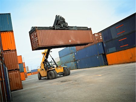 freight ship - Crane Moving and Stacking Shipping Containers Stock Photo - Rights-Managed, Code: 700-03556898