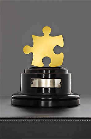 puzzle piece - Gold Puzzle Piece on a Stand Stock Photo - Rights-Managed, Code: 700-03567697