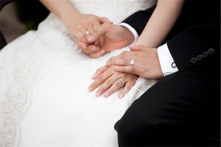 Close-up of Bride and Groom Holding Hands Stock Photo - Rights-Managed, Code: 700-03567845