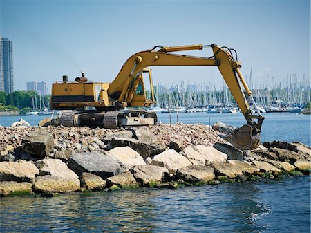 develop - Excavator Moving Boulders at Amos Waites Park, Etobicoke Yacht Club in the Background, Near Mimico Beach, Etobicoke, Ontario, Canada Stock Photo - Rights-Managed, Code: 700-03567877