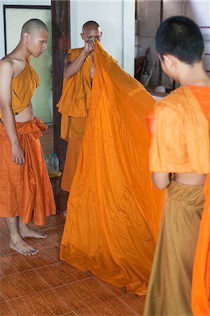 simsearch:700-03586725,k - Young Monks Dressing New Initiate at Buddhist Cremation Ceremony at Wat Luang, Ubon Ratchatani, Thailand Stock Photo - Rights-Managed, Code: 700-03586717