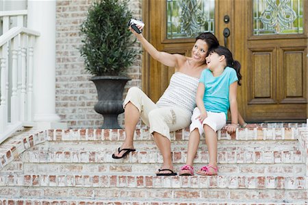 family stairs - Mother and Daughter Using Video Camera Stock Photo - Rights-Managed, Code: 700-03596279