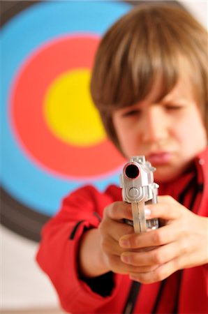 people with guns - Boy Aiming Gun Foto de stock - Con derechos protegidos, Código: 700-03601358