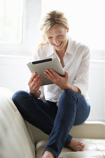 Woman Using iPad Stock Photo - Premium Rights-Managed, Artist: Michael Alberstat, Image code: 700-03601474