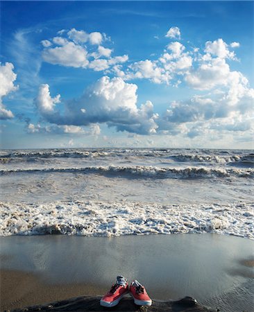 disappearing - Sneakers on Beach with Rough Water Stock Photo - Rights-Managed, Code: 700-03615586