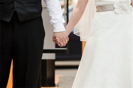 simsearch:700-05786443,k - Bride and Groom Holding Hands Stock Photo - Rights-Managed, Code: 700-03616008