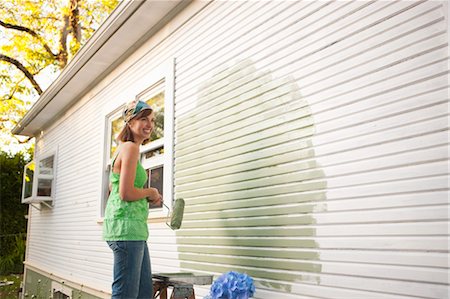 simsearch:600-06671767,k - Young Woman Painting Home Exterior Stock Photo - Rights-Managed, Code: 700-03613058