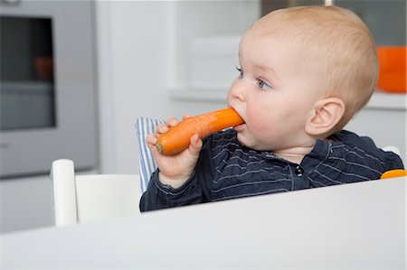 Baby Girl Eating a Carrot Stock Photo - Rights-Managed, Code: 700-03621177