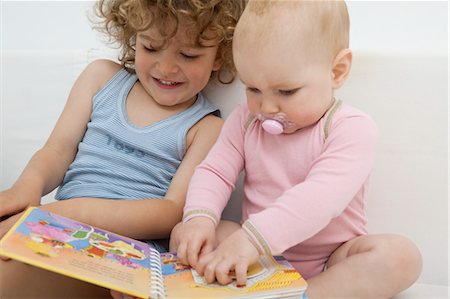 Brother and Sister Reading a Book Stock Photo - Rights-Managed, Code: 700-03621179