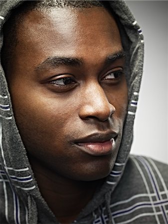 face close up young man looking sideways - Portrait of Young Man Stock Photo - Rights-Managed, Code: 700-03621346