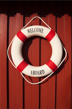 decorative signage on building - Life Ring Hanging on Wall Stock Photo - Rights-Managed, Code: 700-03622718