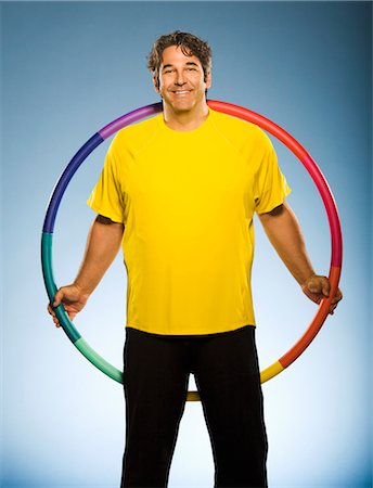 Portrait of Man Holding Hula Hoop Foto de stock - Direito Controlado, Número: 700-03638641