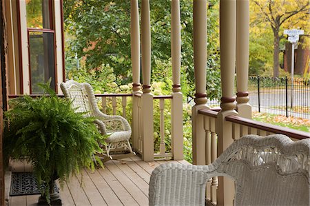 porch rocking chairs - Wicker Furniture On Porch Stock Photo - Rights-Managed, Code: 700-03638851