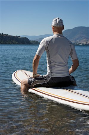 Man Stand Up Paddle Surfing, Okanagan Lake, Penticton, British Columbia, Canada Stock Photo - Rights-Managed, Code: 700-03638954