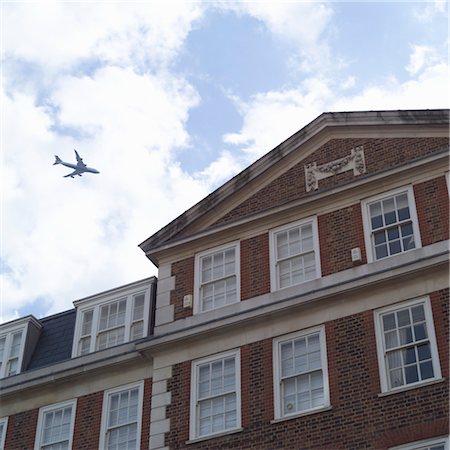 Jet Flying Over Building, Londres, Angleterre Photographie de stock - Rights-Managed, Code: 700-03644346