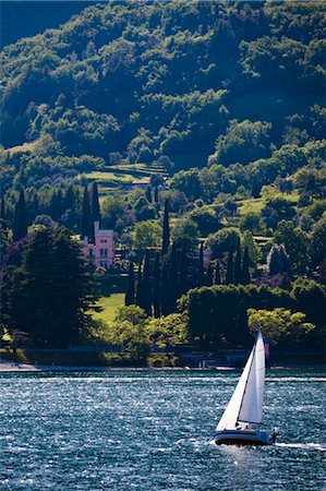 sailing boats - Sailboat and Cadenabbia, Lake Como, Lombardy, Italy Stock Photo - Rights-Managed, Code: 700-03644358