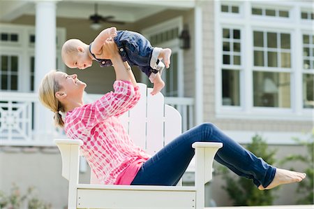 Mother and Son Sitting in Chair on Lawn Stock Photo - Rights-Managed, Code: 700-03644553