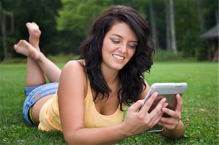 reading book on computer - Portrait of Woman Outdoors Stock Photo - Rights-Managed, Code: 700-03644983