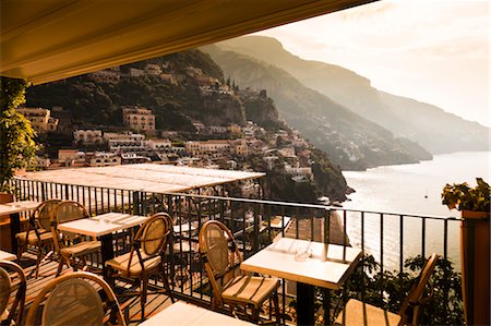 restaurants patio furniture - Table and Chairs on Balcony Overlooking Sea, Positano, Campania, Italy Stock Photo - Rights-Managed, Code: 700-03641094