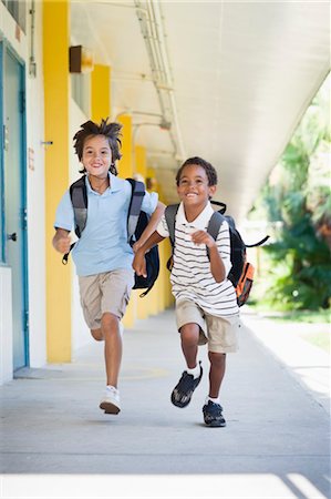 Boys Running at School Foto de stock - Direito Controlado, Número: 700-03659115