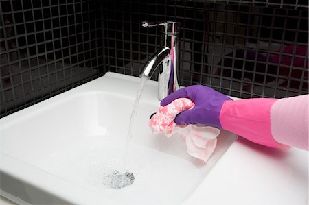 rubber glove - Woman Cleaning Bathroom Sink Stock Photo - Rights-Managed, Code: 700-03659179