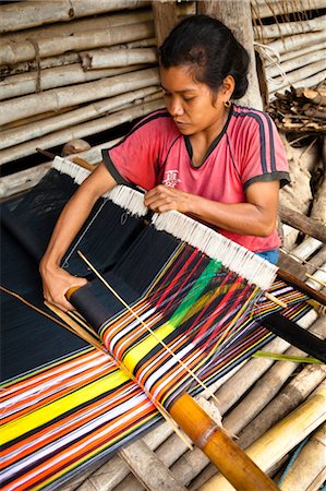 Woman Weaving Ikat Cloth, Sumba, Indonesia Fotografie stock - Rights-Managed, Codice: 700-03665837