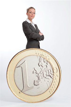 euro - Businesswoman with Large Euro Coin Stock Photo - Rights-Managed, Code: 700-03685946