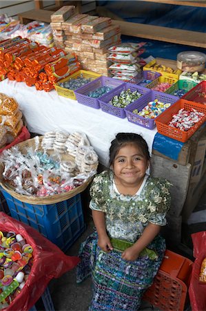 Young Girl Selling Candy at Market Foto de stock - Con derechos protegidos, Código: 700-03686225