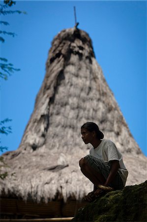 rooftop silhouette - Woman Crouching, Pahola Village, Sumba, Indonesia Stock Photo - Rights-Managed, Code: 700-03696908