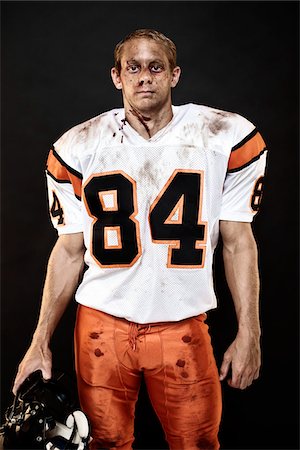 Portrait of Dirty, Bleeding Football Player Foto de stock - Con derechos protegidos, Código: 700-03698168