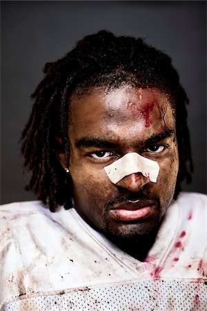 pictures of black men goatees - Close-Up of Injured Football Player Stock Photo - Rights-Managed, Code: 700-03698186