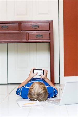 disinterested - Boy with Cell Phone Stock Photo - Rights-Managed, Code: 700-03719326