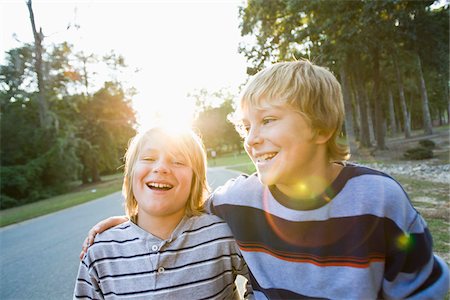 family walking smile - Brothers Outdoors with Arms Around Each Other Stock Photo - Rights-Managed, Code: 700-03719320