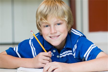 Boy Doing Homework Foto de stock - Con derechos protegidos, Código: 700-03719321