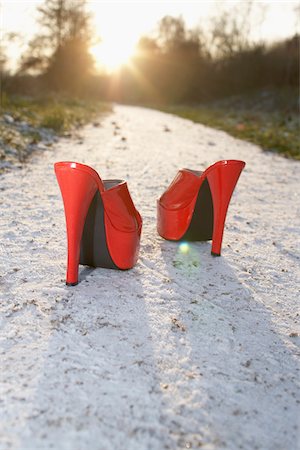 simsearch:700-03738120,k - Red High Heel Shoes on Sandy Path Stock Photo - Rights-Managed, Code: 700-03738120