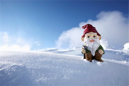 snow - Garden Gnome on Side of Snow Covered Mountain Stock Photo - Rights-Managed, Code: 700-03739363