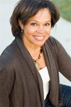 Portrait of smiling African American mature woman, studio shot