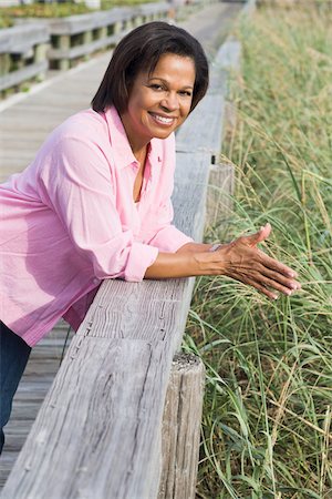 simsearch:700-03762638,k - Woman Leaning on Boardwalk Railing Stock Photo - Rights-Managed, Code: 700-03762653