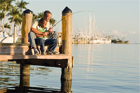 Father and Son Fishing from Pier Stock Photo - Rights-Managed, Code: 700-03762729