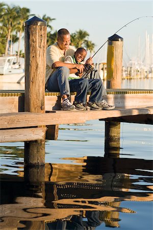 sportfishing boat - Father and Son Fishing from Pier Stock Photo - Rights-Managed, Code: 700-03762730