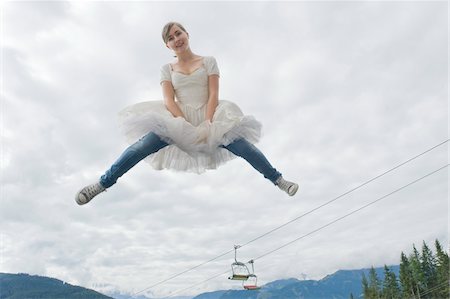 Teenage Girl Wearing Ballerina Dress Jumping into Air Stock Photo - Rights-Managed, Code: 700-03777744