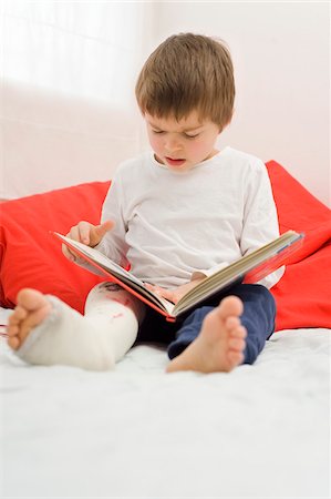 plaster - Boy with Cast on Leg Looking at Book Stock Photo - Rights-Managed, Code: 700-03777766