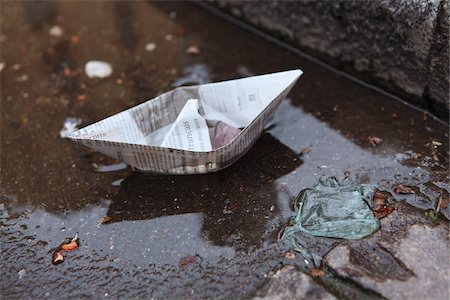 paper boat - Paper Boat in Gutter Stock Photo - Rights-Managed, Code: 700-03777882