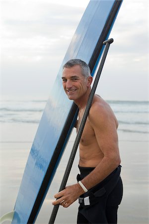 single man baby boomer - Man with Surfboard and Paddle Stock Photo - Rights-Managed, Code: 700-03787171