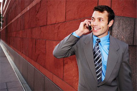 Businessman Using Cell Phone Foto de stock - Con derechos protegidos, Código: 700-03787629