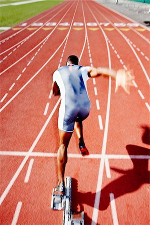 running track race - Runner Leaving Starting Block Stock Photo - Rights-Managed, Code: 700-03787631